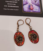 Boucles roses de bronze