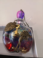 fiole magique rouge mauve or